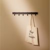 Designfabrik Hamburg Garderobenleiste, Wandgarderobe aus Metall, Garderobenhaken modern, verschiebbare Haken, schwebende Optik Bild 2