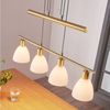 Lindby Hängeleuchte Simeon, Glas Gold / Messing IP20, 4 x 40 W Bild 1