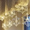 EMOS Mini Lichtervorhang mit 8 Schneeflocken, LED-Lichterkette mit Wintermotiv, Warmweiß, Lichtergirlande 84cm + Netzteil, Leuchtdauer 10.000 h, IP44 für Innen und Außen, für Party, Weihnachten Bild 2