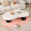Couchtisch 95 x 62,5 x 32 cm in Wolkenform, MDF mit LED-Farbwechsel, runde Beine Bild 3
