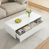 Dieser moderne LED-Couchtisch verfügt über eine gewellte Schubladenplatte, gold-weiße Beine, zwei Schubladen und einen farbwechselnden LED-Lichtstreifen. Ein passender TV-Schrank ist ebenfalls erhältl Bild 4