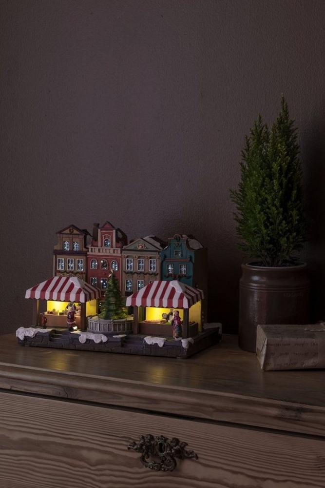 KONSTSMIDE Weihnachtsstadt Weihnachtsdeko, LED Fiberoptikhaus mit Stadtszene und rotierendem Weihnachtsbaum Bild 1