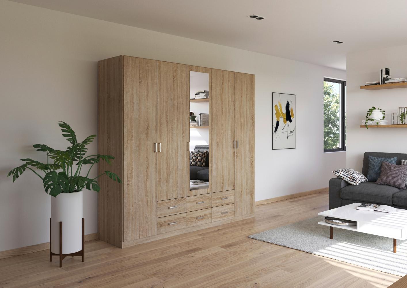 rauch Kleiderschrank, Drehtürenschrank GAMMA, 5-türig, 1 Spiegeltüre teilaufgelegt, 6 Schubkästen, Eiche Sonoma, 226 x 210 x 54 cm Bild 1