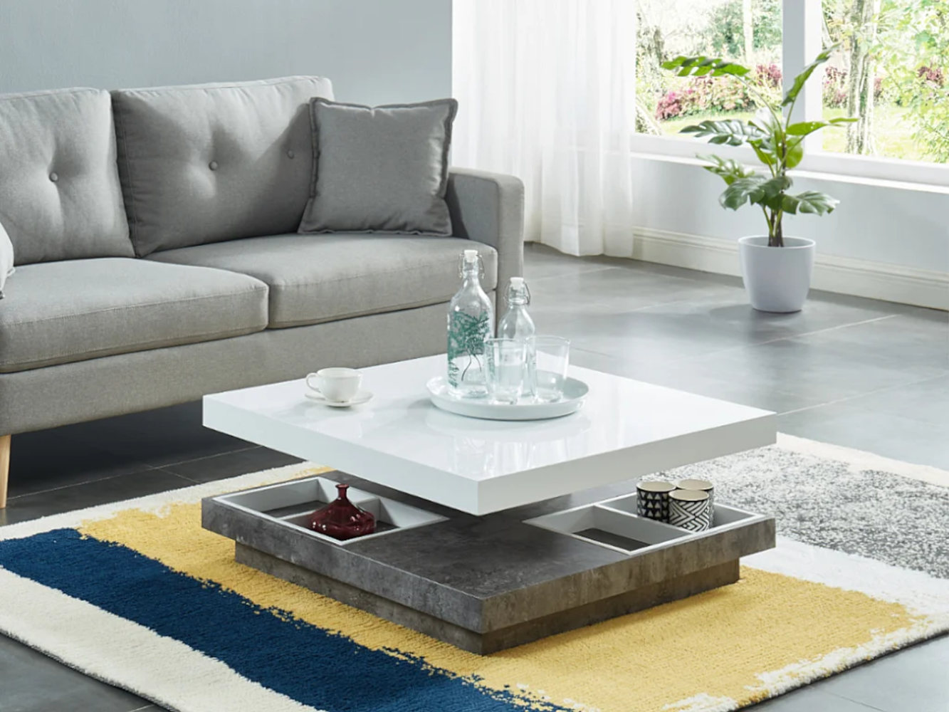 Vente-unique - Couchtisch mit drehbarer Tischplatte - MDF - Weiß lackiert & Beton-Optik - FAUSTO II Bild 1