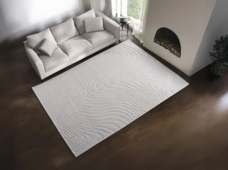 Vente-unique - Relief-Teppich mit abstraktem Muster - 100 % Wolle - handgetuftet - 200 x 290 cm - Elfenbeinfarben - CELESTIA