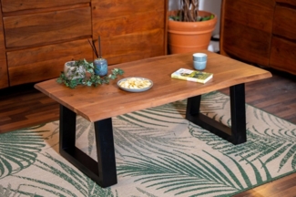 SAM® Couchtisch Flower, massives Akazienholz, Trapezgestell aus Metall in schwarz, Baumkante