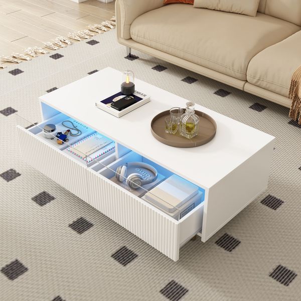 Dieser moderne LED-Couchtisch verfügt über eine gewellte Schubladenplatte,110×50×40 cm, Weiß,modernes Design, viel Stauraum