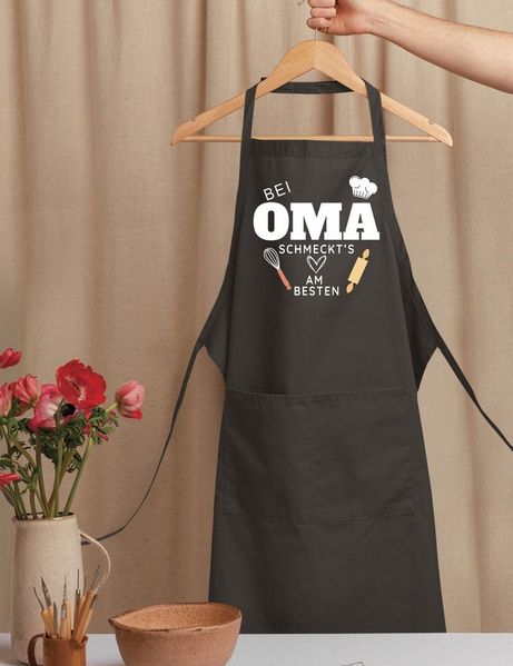 Youth Designz Grillschürze Damen Schürze "Bei Oma schmeckt es am Besten" Print Kochschürze, mit lustigem Spruch & Logo Aufdruck