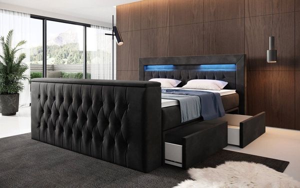 Luxusbetten24 Boxspringbett Menzogna, mit TV Lift, USB und Stauraum (2 Schubladen)