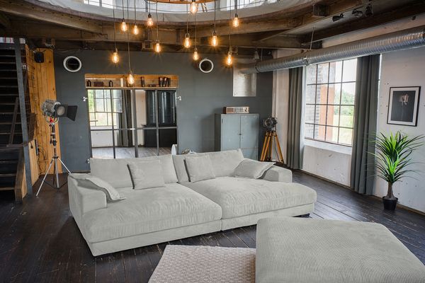 KAWOLA Big Sofa MADELINE Cord hellgrau mit Hocker und 4 Zierkissen 85 x 170 x 290 cm