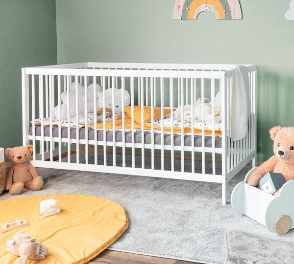 Babybett TONI 70x140 cm weiß mit Rausfallschutz und Matratze