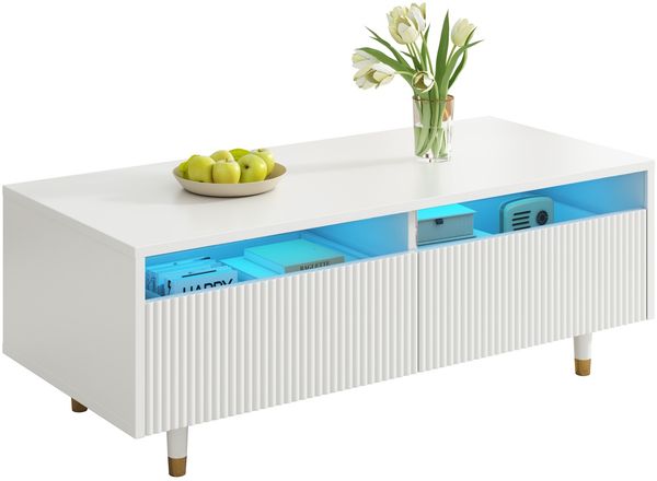 Dieser moderne LED-Couchtisch verfügt über eine gewellte Schubladenplatte, gold-weiße Beine, zwei Schubladen und einen farbwechselnden LED-Lichtstreifen. Ein passender TV-Schrank ist ebenfalls erhältl